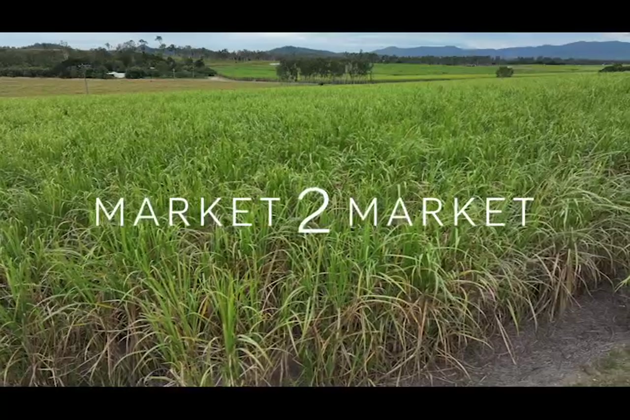 Aerial footage over rural, agricultural field in Mackay