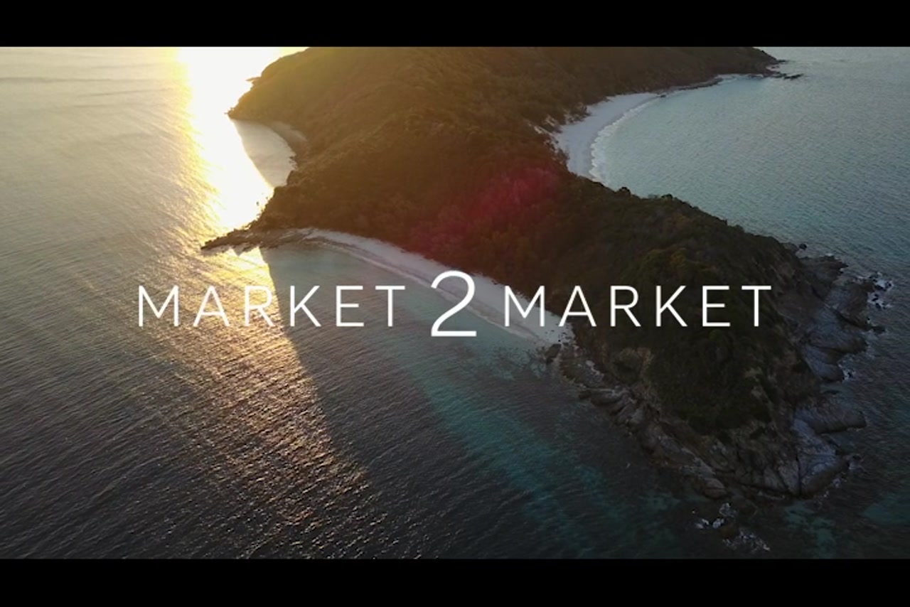 Aerial footage over the beaches of Great Keppel Island at dusk