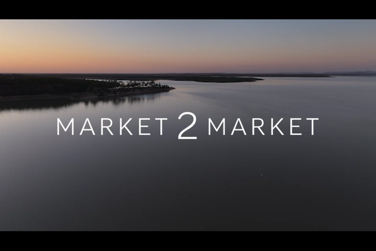 Aerial footage over a dam at dusk