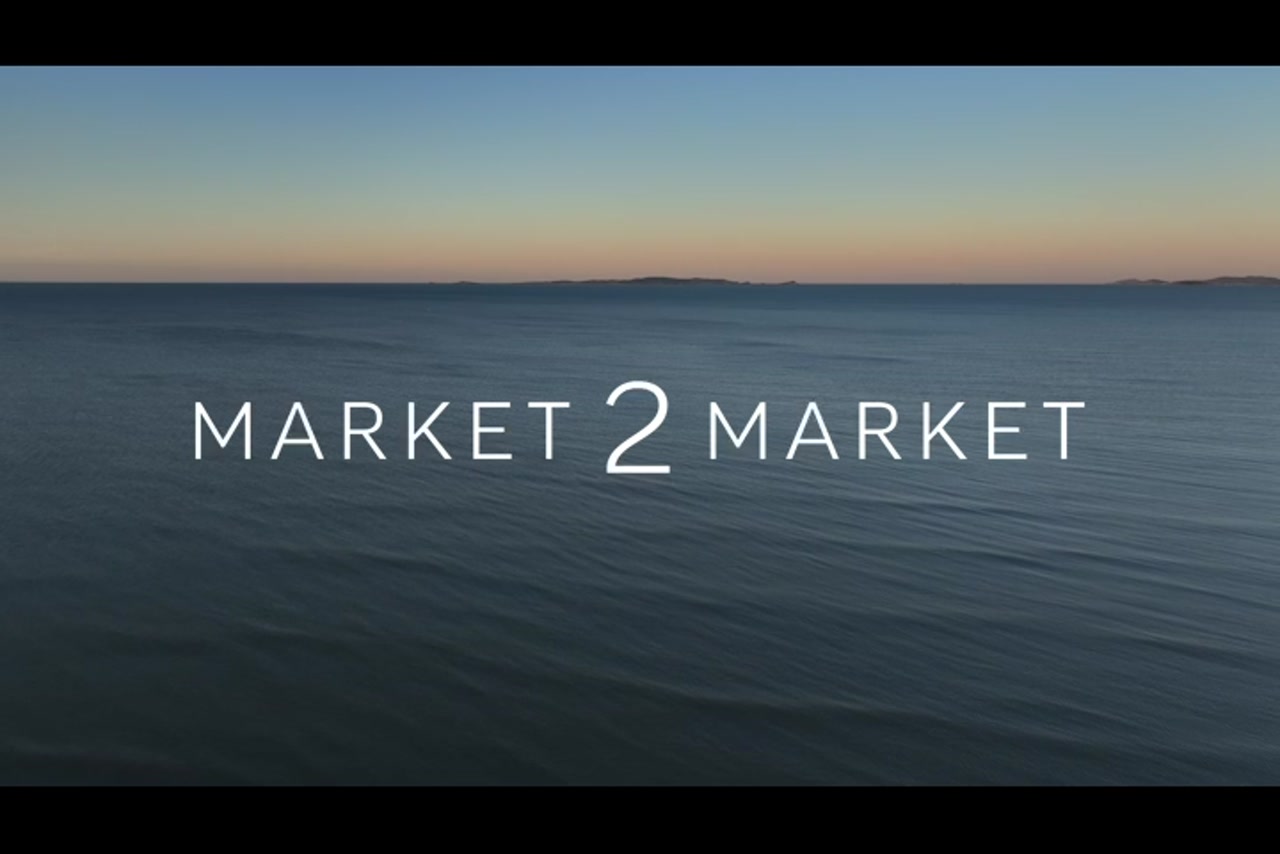 Aerial footage over ocean at dusk